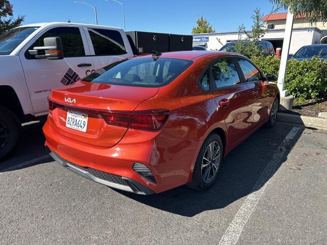 Photo of 2022 Fire Orange Kia Forte