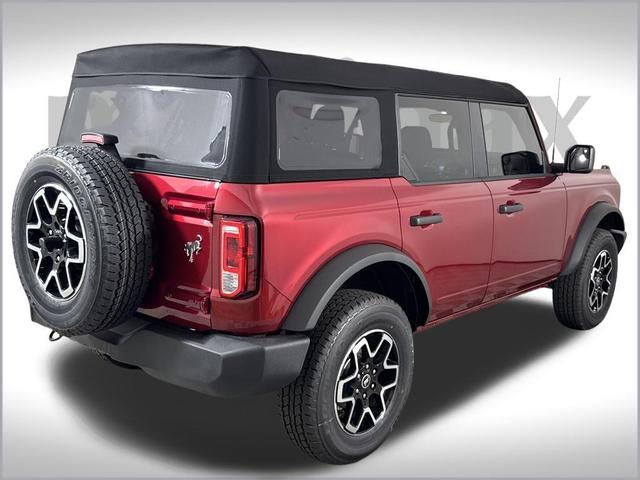 Photo of 2025 Ruby Red Metallic Tinted Clearcoat Ford Bronco