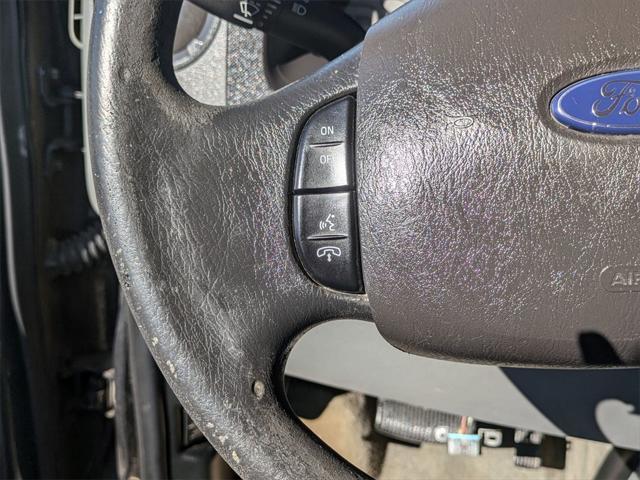 Photo of 2012 Black Ford E350 Super Duty