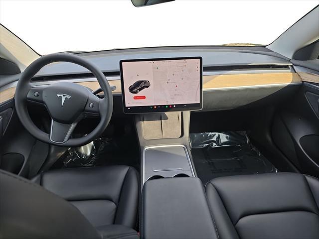 Photo of 2022 Solid Black Tesla Model 3
