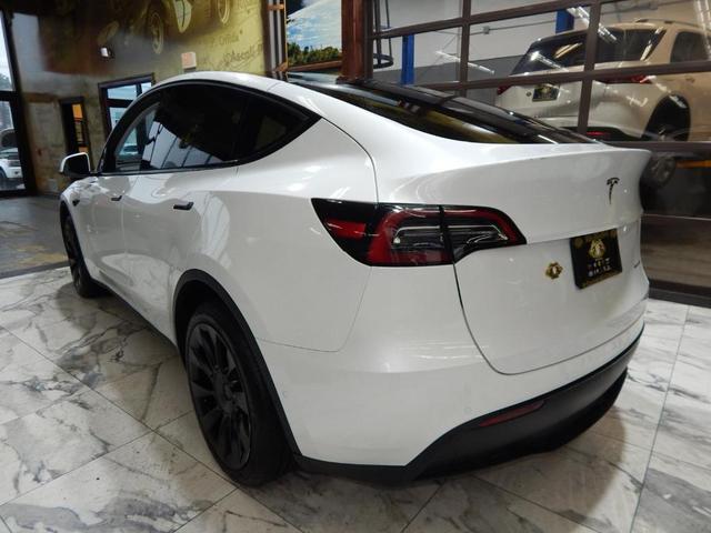 Photo of 2023 Pearl White Multi Tesla Model Y