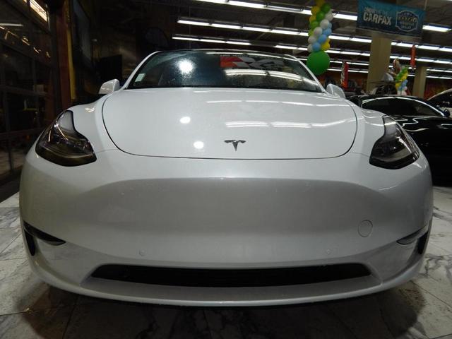 Photo of 2023 Pearl White Multi Tesla Model Y
