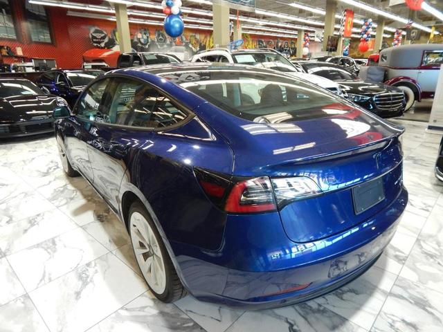 Photo of 2022 Deep Blue Metallic Tesla Model 3