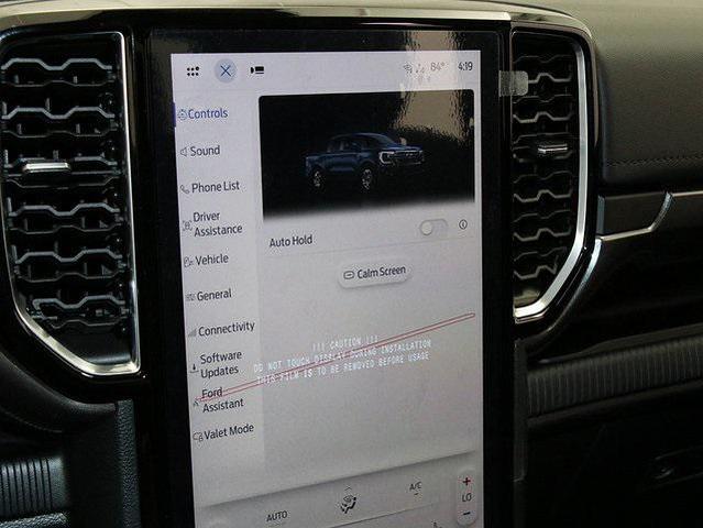 Photo of 2025 Ruby Red Metallic Tinted Clearcoat Ford Ranger