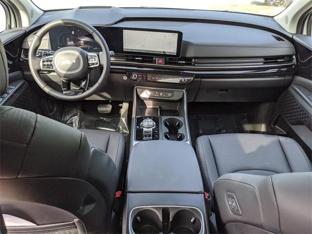 Photo of 2025 Snow White Pearl Kia Carnival Hybrid