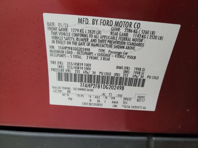 Photo of 2013 Ruby Red Metallic Tinted Clearcoat Ford Taurus