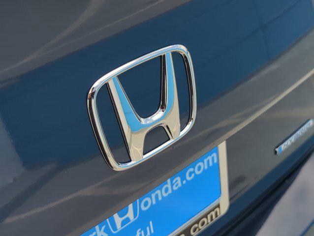 Photo of 2025 Blue Lagoon Pearl Honda Civic Hybrid