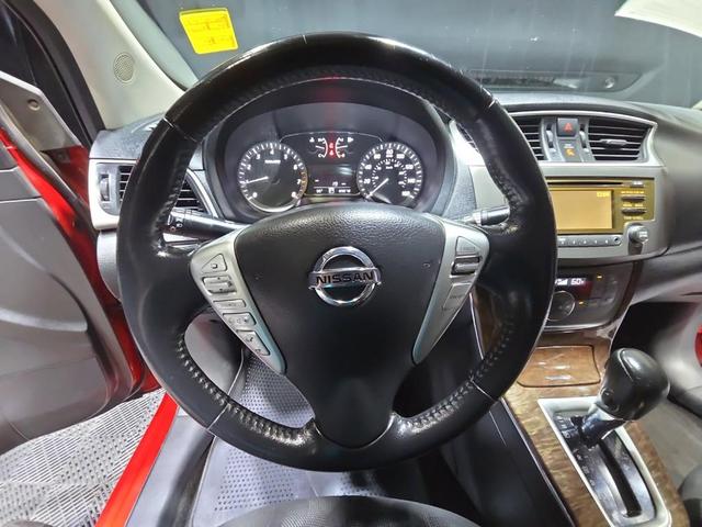Photo of 2013 Red Brick Nissan Sentra