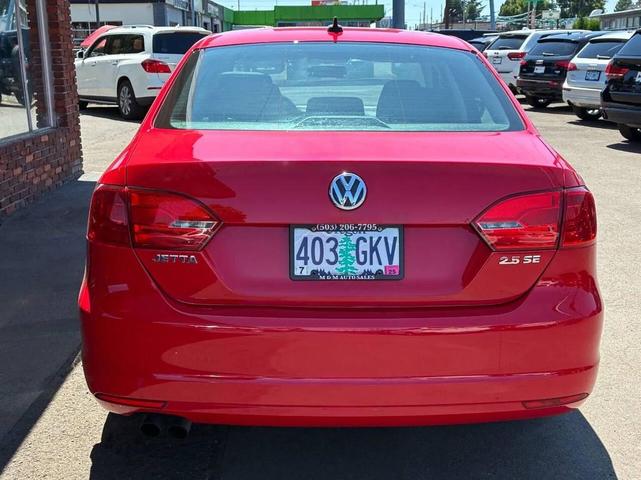 Photo of 2013 Tornado Red Volkswagen Jetta