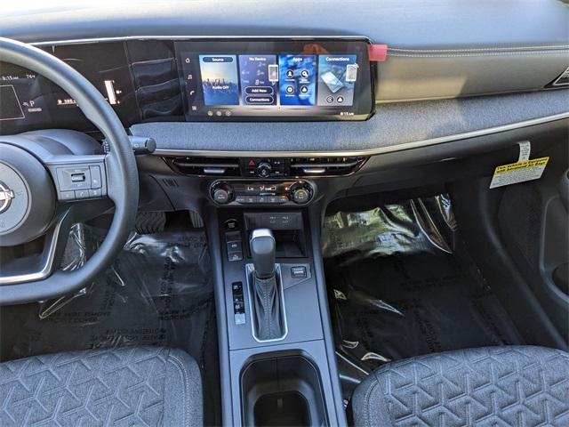 Photo of 2026 Aspen White Tri Nissan Kicks