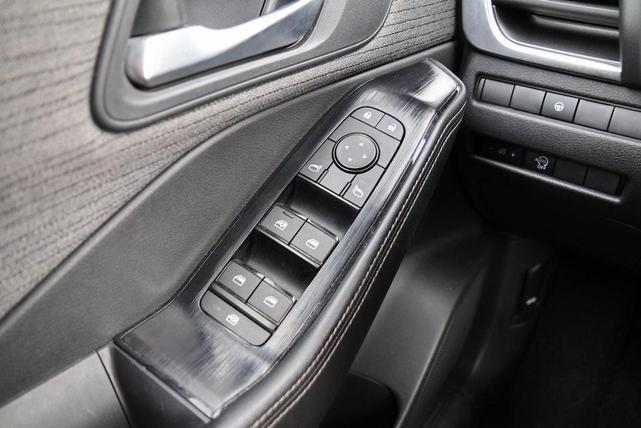 Photo of 2023 Pearl White Tricoat Nissan Rogue