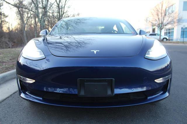 Photo of 2018 Deep Blue Metallic Tesla Model 3