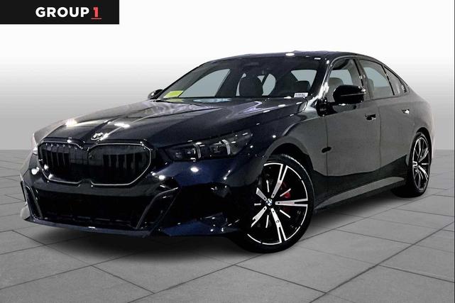 Photo of 2024 Carbon Black Metallic BMW 530