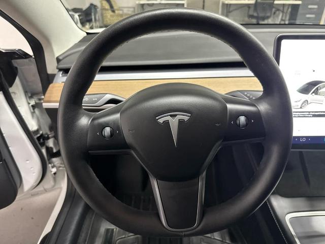 Photo of 2021 Pearl White Multi Tesla Model 3