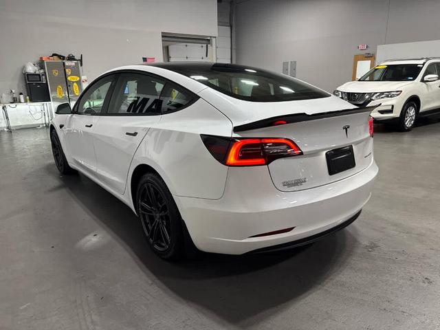 Photo of 2021 Pearl White Multi Tesla Model 3