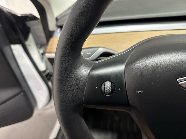 Photo of 2021 Pearl White Multi Tesla Model 3