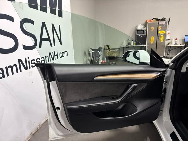 Photo of 2021 Pearl White Multi Tesla Model 3