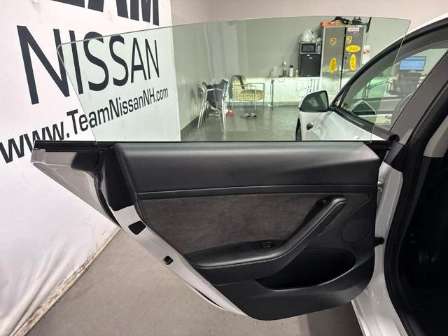 Photo of 2021 Pearl White Multi Tesla Model 3