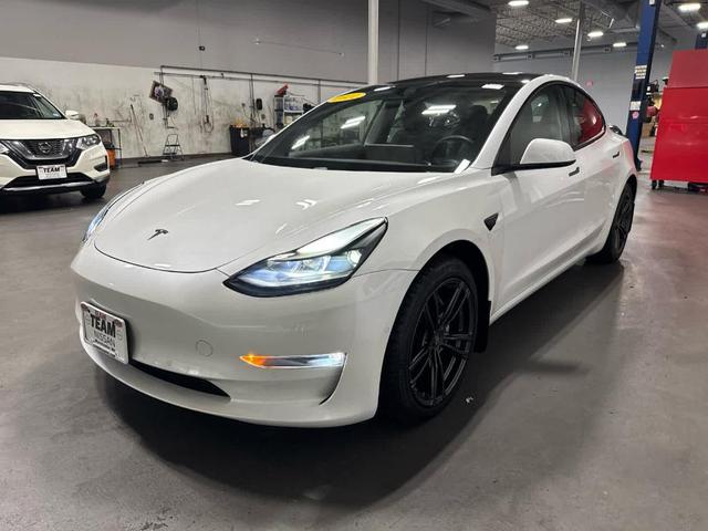 Photo of 2021 Pearl White Multi Tesla Model 3