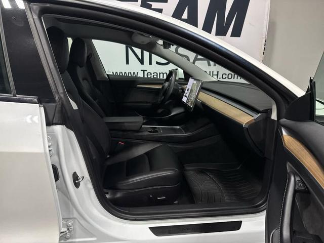 Photo of 2021 Pearl White Multi Tesla Model 3