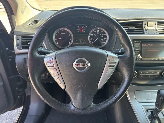 Photo of 2015 Super Black Nissan Sentra