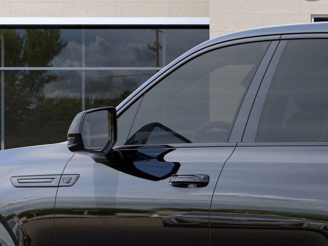 Photo of 2025 Black Raven Cadillac Escalade IQ