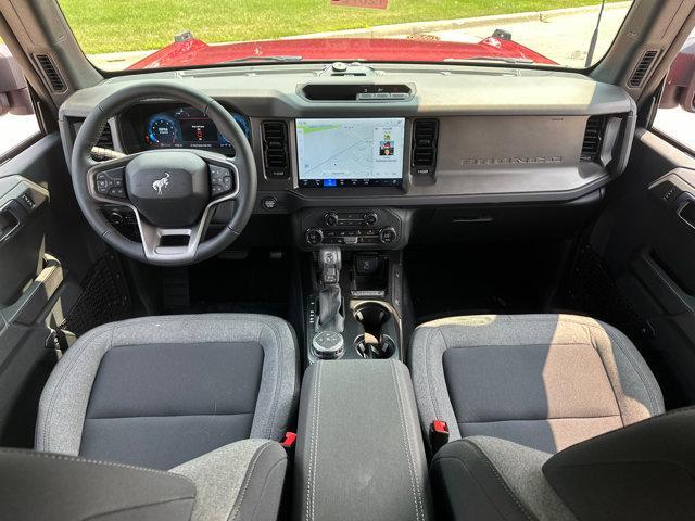 Photo of 2025 Ruby Red Metallic Tinted Clearcoat Ford Bronco