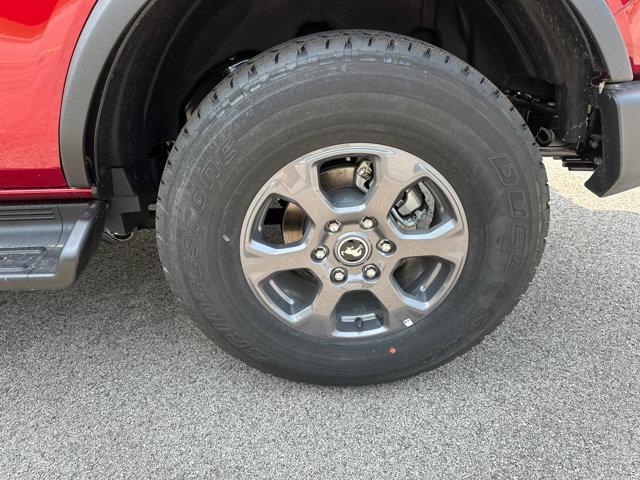 Photo of 2025 Ruby Red Metallic Tinted Clearcoat Ford Bronco