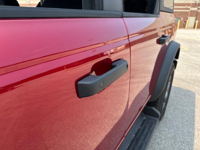 Photo of 2025 Ruby Red Metallic Tinted Clearcoat Ford Bronco