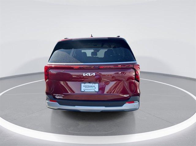 Photo of 2025 Flare Red Kia Carnival Hybrid