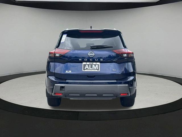 Photo of 2025 Deep Ocean Blue Pearl/Super Black Nissan Rogue