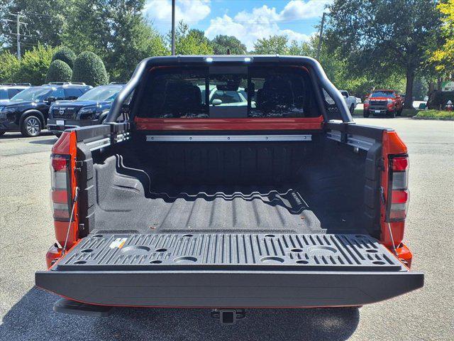 Photo of 2025 Afterburn Orange Nissan Frontier