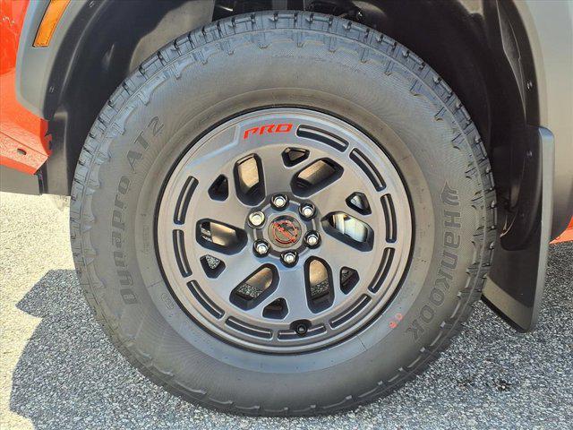 Photo of 2025 Afterburn Orange Nissan Frontier
