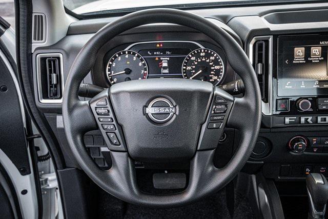 Photo of 2025 Glacier White Nissan Frontier