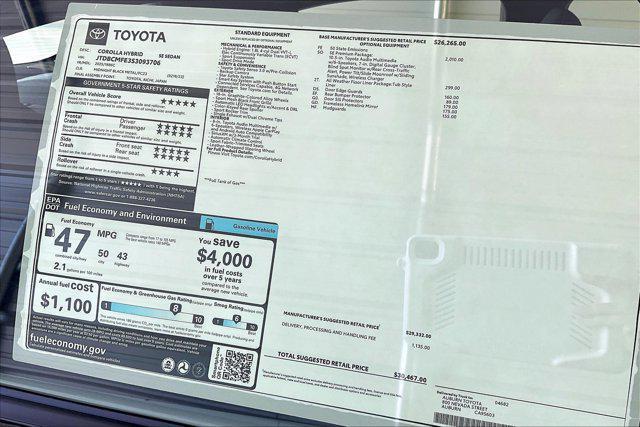 Photo of 2025 Midnight Black Metallic Toyota Corolla Hybrid