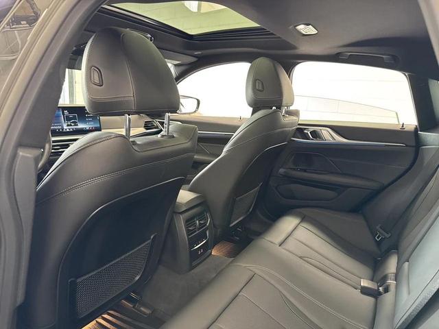 Photo of 2024 Black Sapphire Metallic BMW i4 Gran Coupe