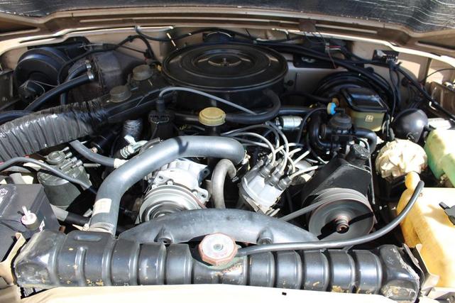 Photo of 1990 Sand Metallic Jeep Grand Wagoneer