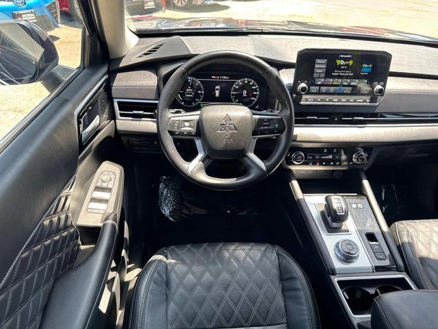 Photo of 2023 Black Diamond/Deep Bronze Metallic Mitsubishi Outlander PHEV