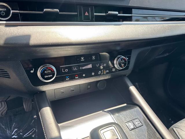 Photo of 2023 Black Diamond/Deep Bronze Metallic Mitsubishi Outlander PHEV