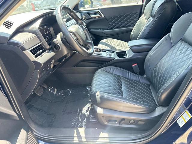 Photo of 2023 Black Diamond/Deep Bronze Metallic Mitsubishi Outlander PHEV