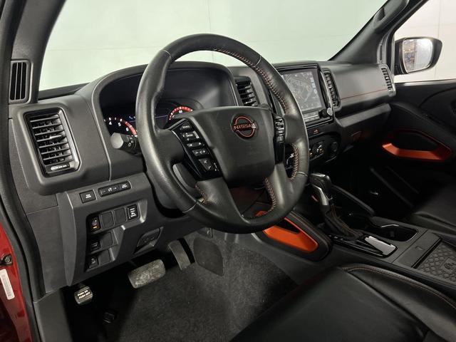 Photo of 2023 Cardinal Red Metallic Tricoat Nissan Frontier