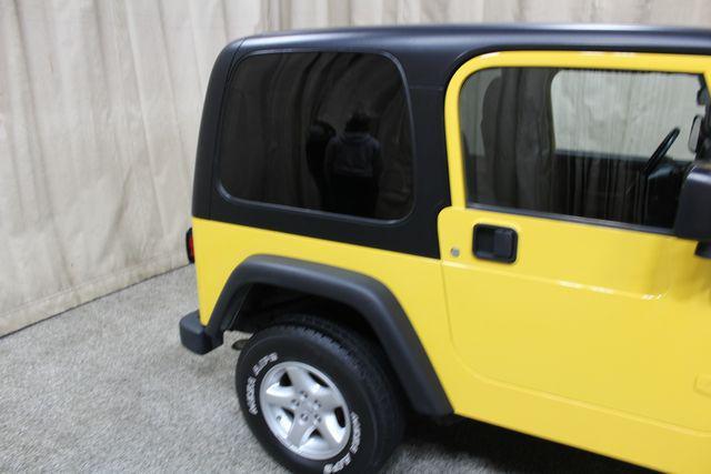 Photo of 2004 Solar Yellow Clearcoat/Black Hard Top Jeep Wrangler