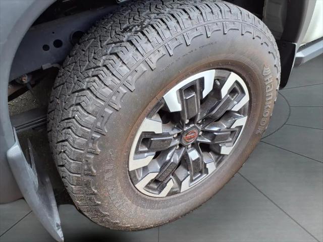 Photo of 2023 Glacier White Nissan Frontier