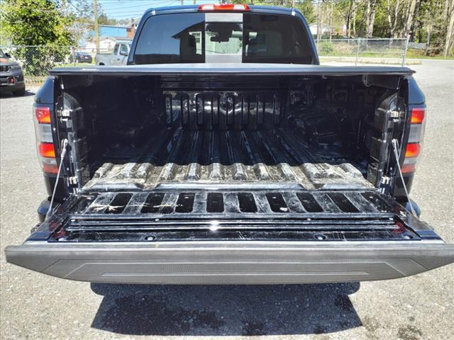 Photo of 2024 Super Black Kh3 Nissan Frontier