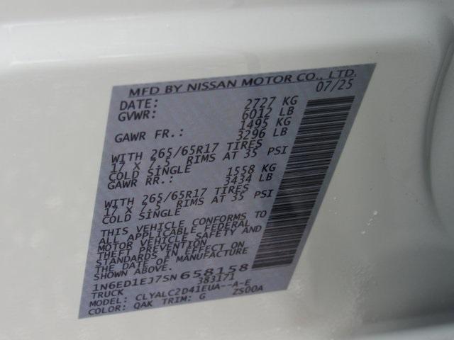 Photo of 2025 Glacier White Nissan Frontier