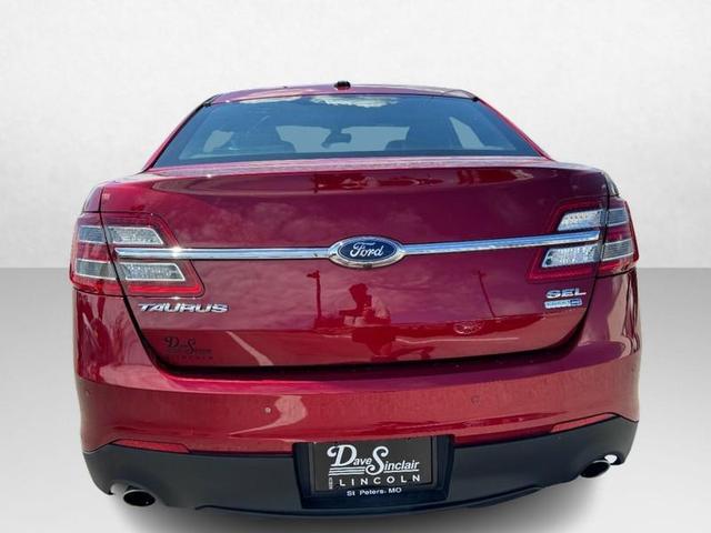 Photo of 2017 RUBY RED TINTED CLEARCOAT Ford Taurus