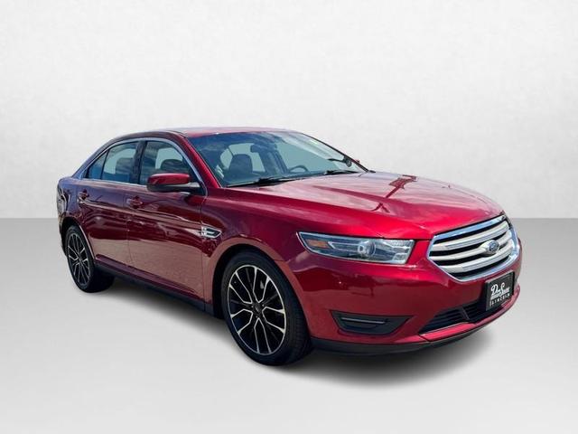 Photo of 2017 RUBY RED TINTED CLEARCOAT Ford Taurus