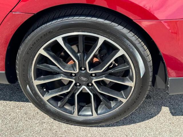 Photo of 2017 RUBY RED TINTED CLEARCOAT Ford Taurus