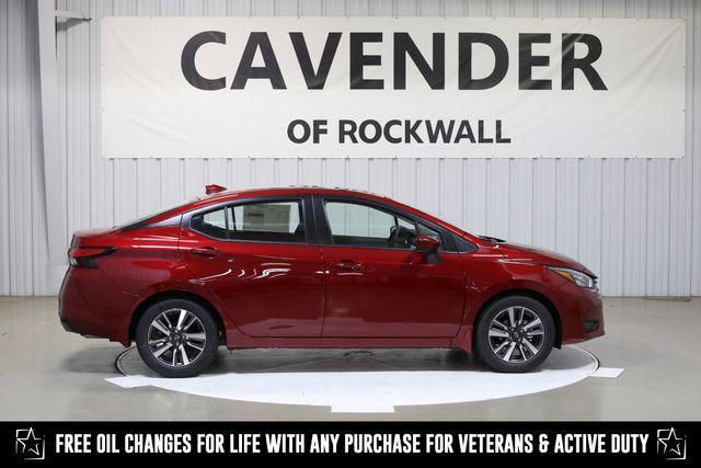 Photo of 2025 Scarlet Ember Tintcoat Nissan Versa