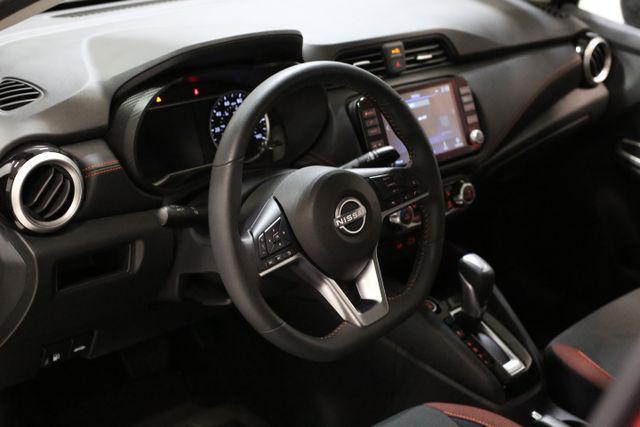 Photo of 2025 Scarlet Ember Tintcoat Nissan Versa